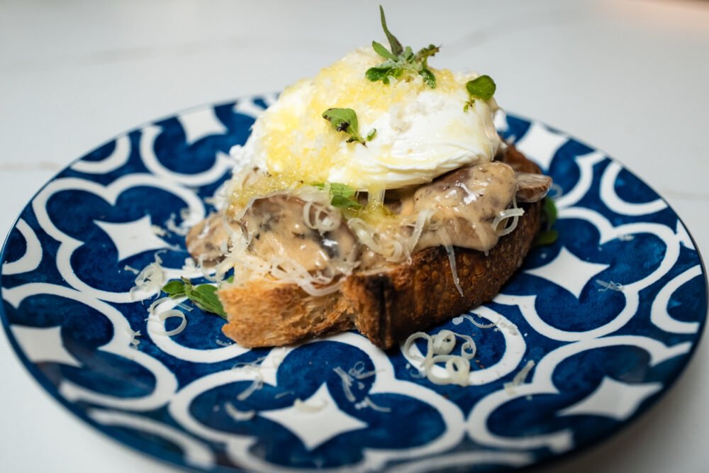 Creamy Mushroom Toast with Gruyère and Poached Eggs side angle