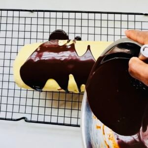 Simple Chocolate Ganache poured over a tiramisu yule log