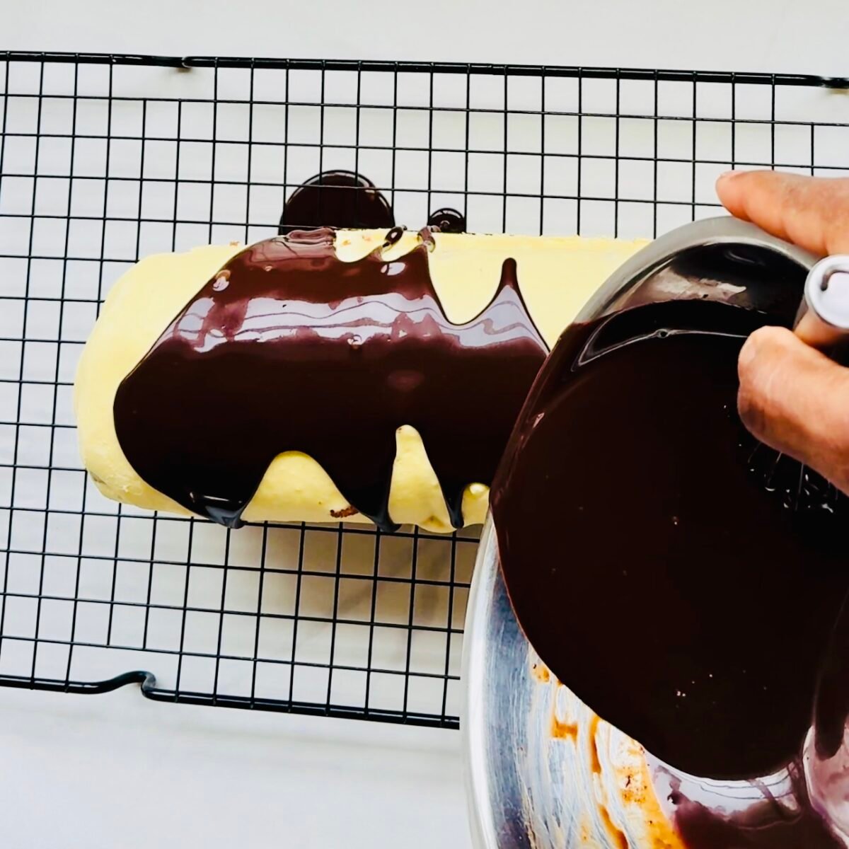 Simple Chocolate Ganache poured over a tiramisu yule log