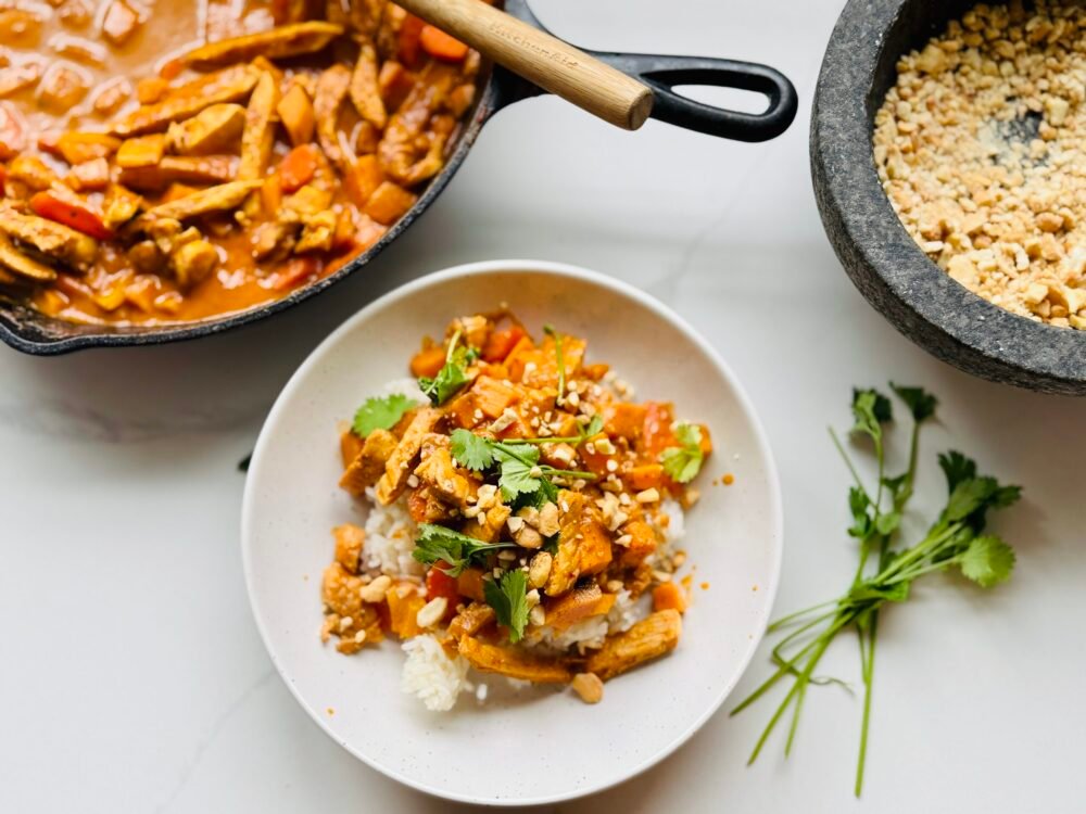 Panang Curry served over rice overhead shot