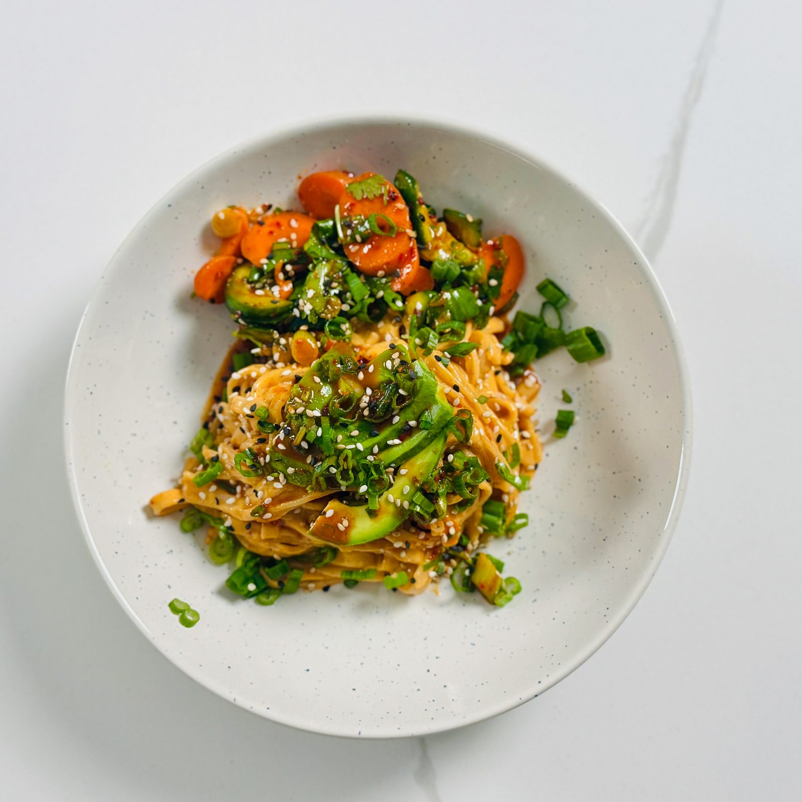 Smashed Cucumber Carrot Salad with Creamy Sesame Peanut Noodle Bowl