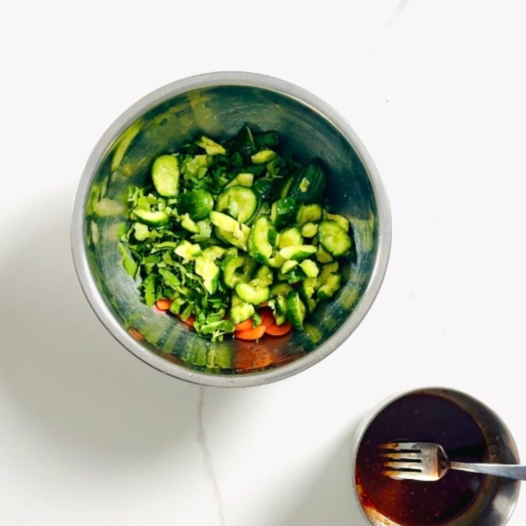 Smashed Cucumber Carrot Salad ingredient in a bowl