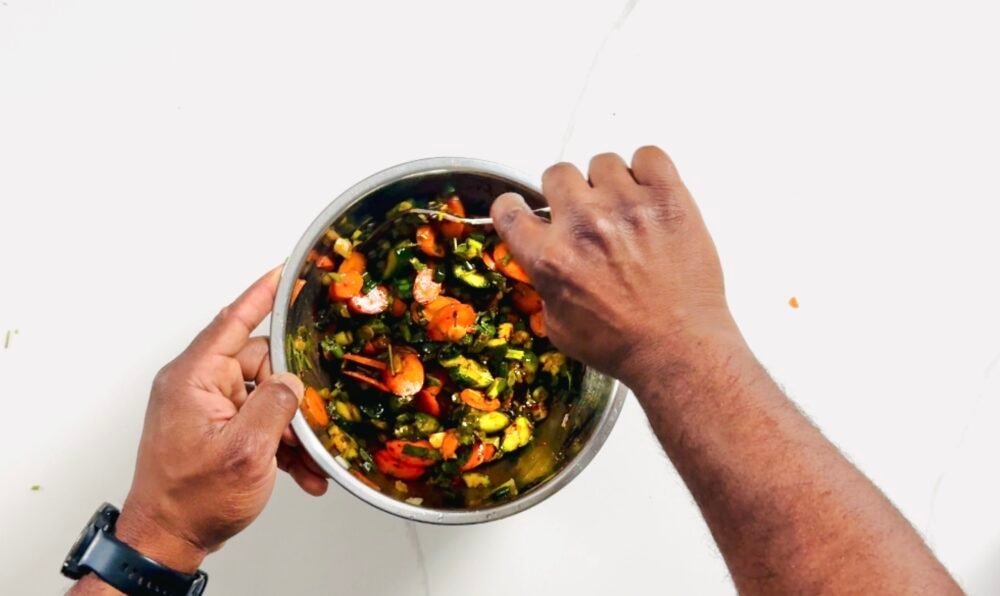 Smashed Cucumber Carrot Salad being stirred