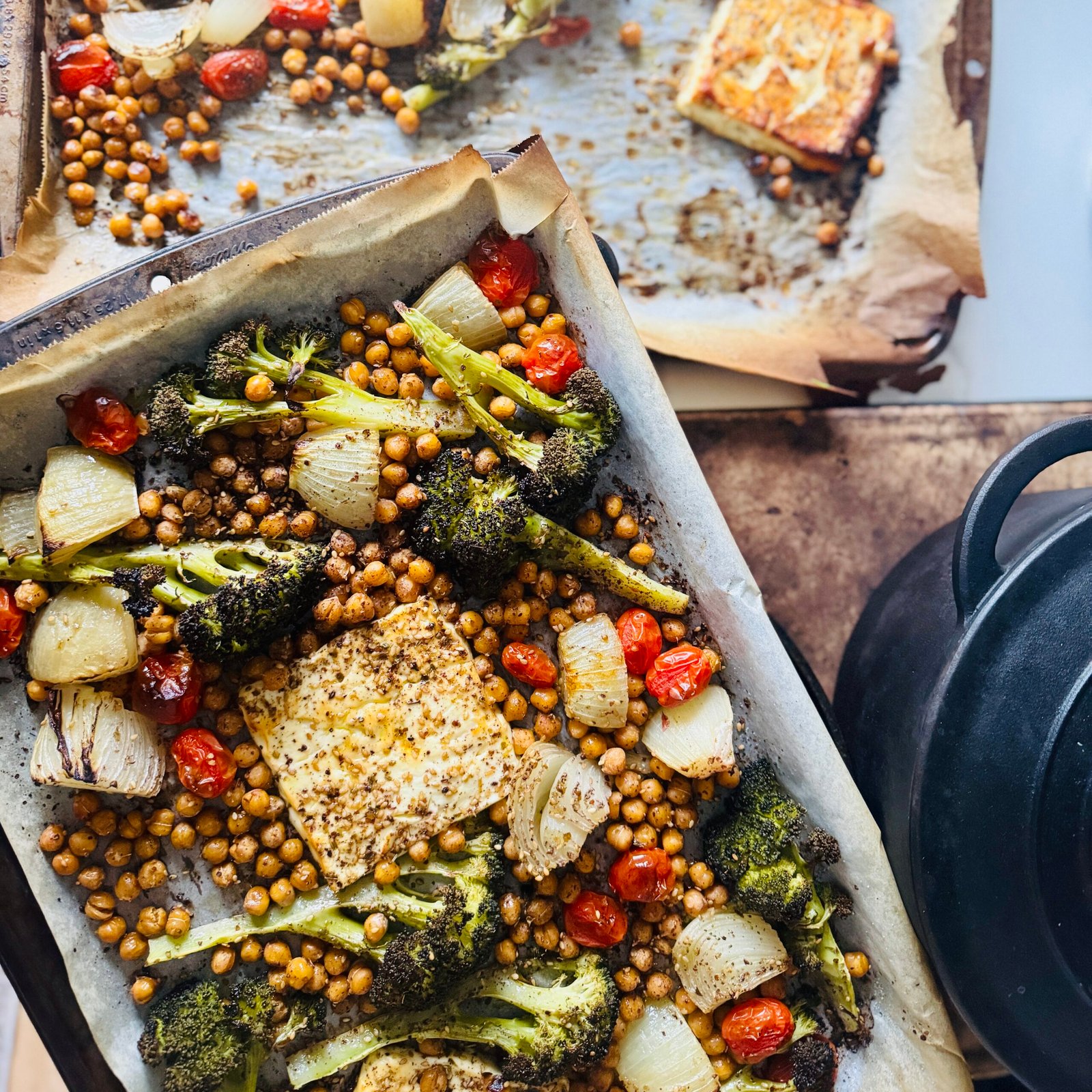 Za’atar Baked Feta with Chickpeas, tomatoes, onions, and Broccoli on a sheet pan
