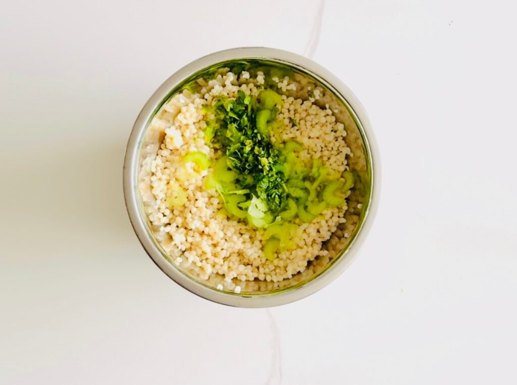 pearl couscous tossed it with olive oil, vinegar, lime juice, lime zest, mint, parsley, celery, and leeks