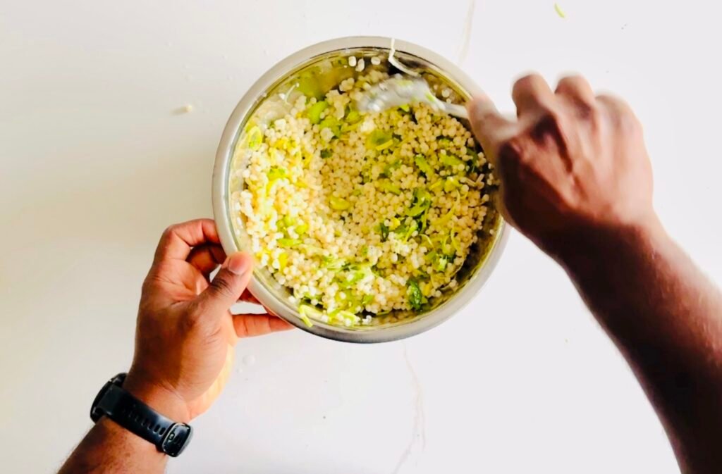 pearl couscous tossed it with olive oil, vinegar, lime juice, lime zest, mint, parsley, celery, and leeks