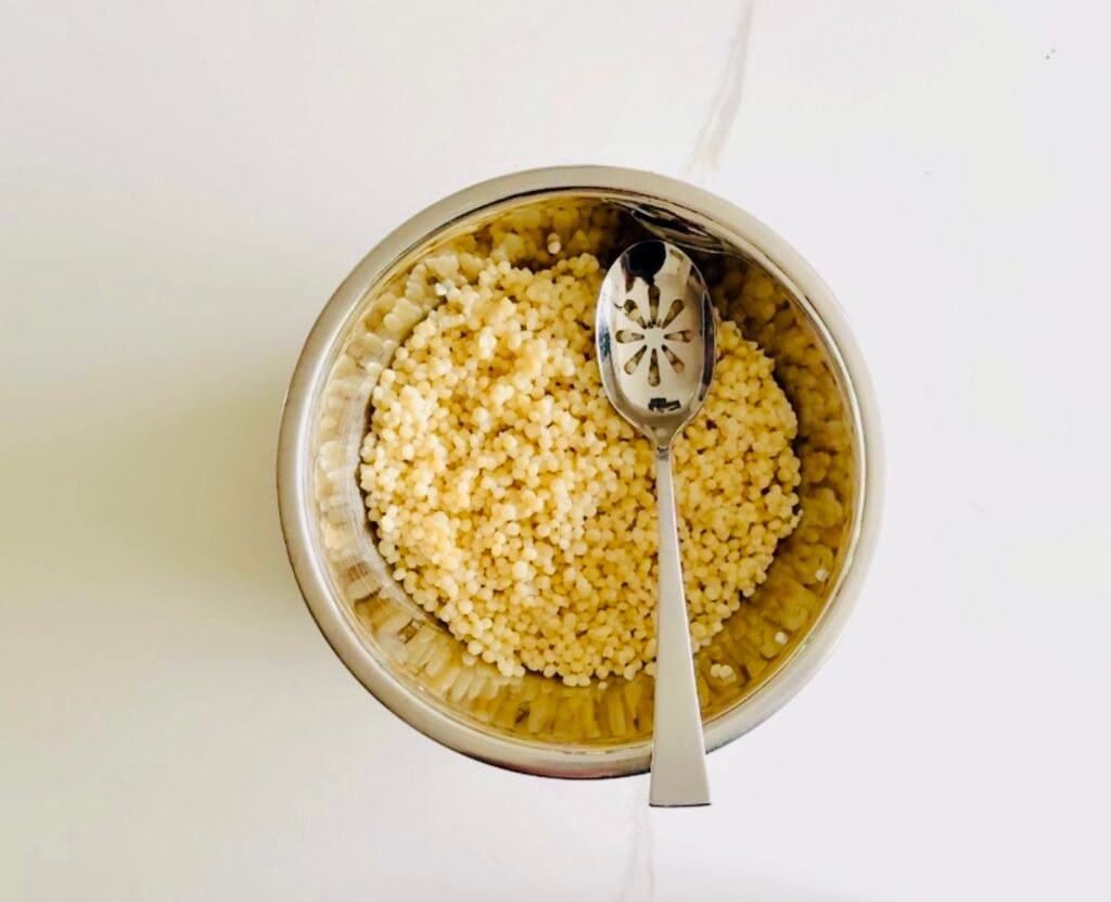 pearl couscous tossed it with olive oil, vinegar, lime juice, lime zest, mint, parsley, celery, and leeks