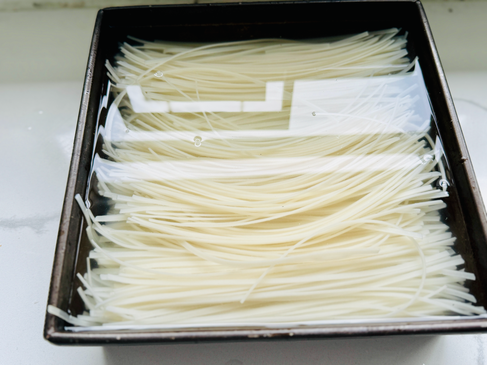  Pad Thai rice noodles soaking in water 