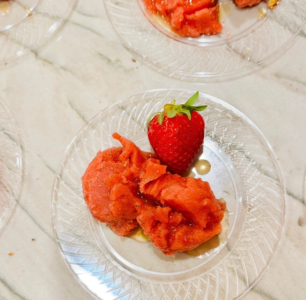 Strawberry mint sorbet topped with mint syrup and fresh strawberry