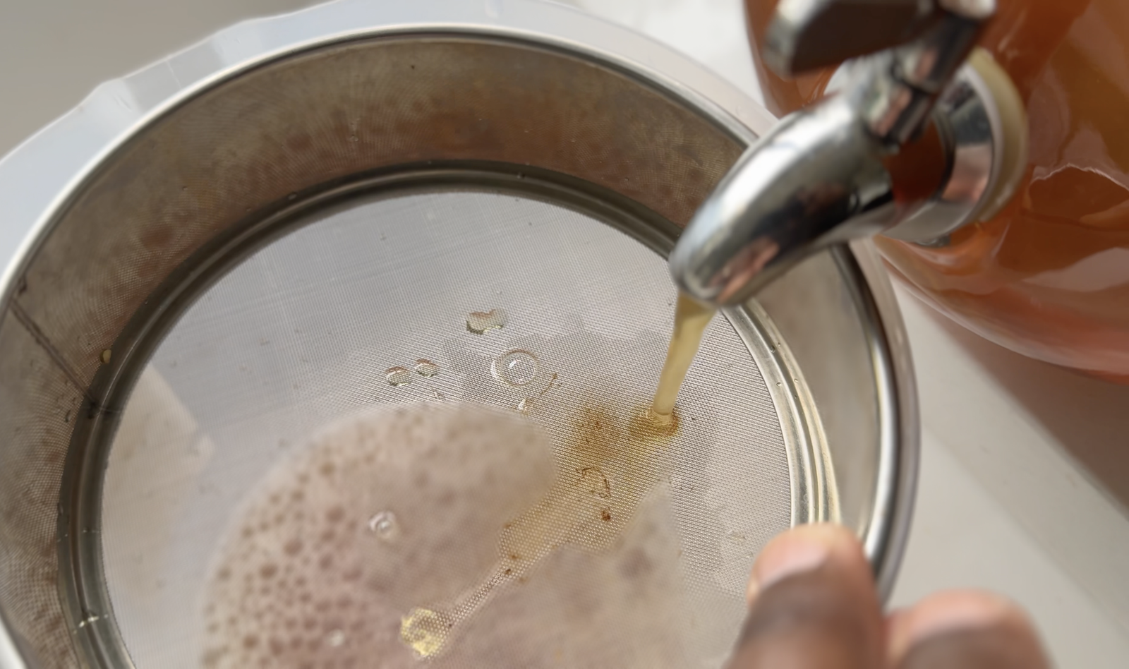 Straining Homemade Kombucha for second fermentation