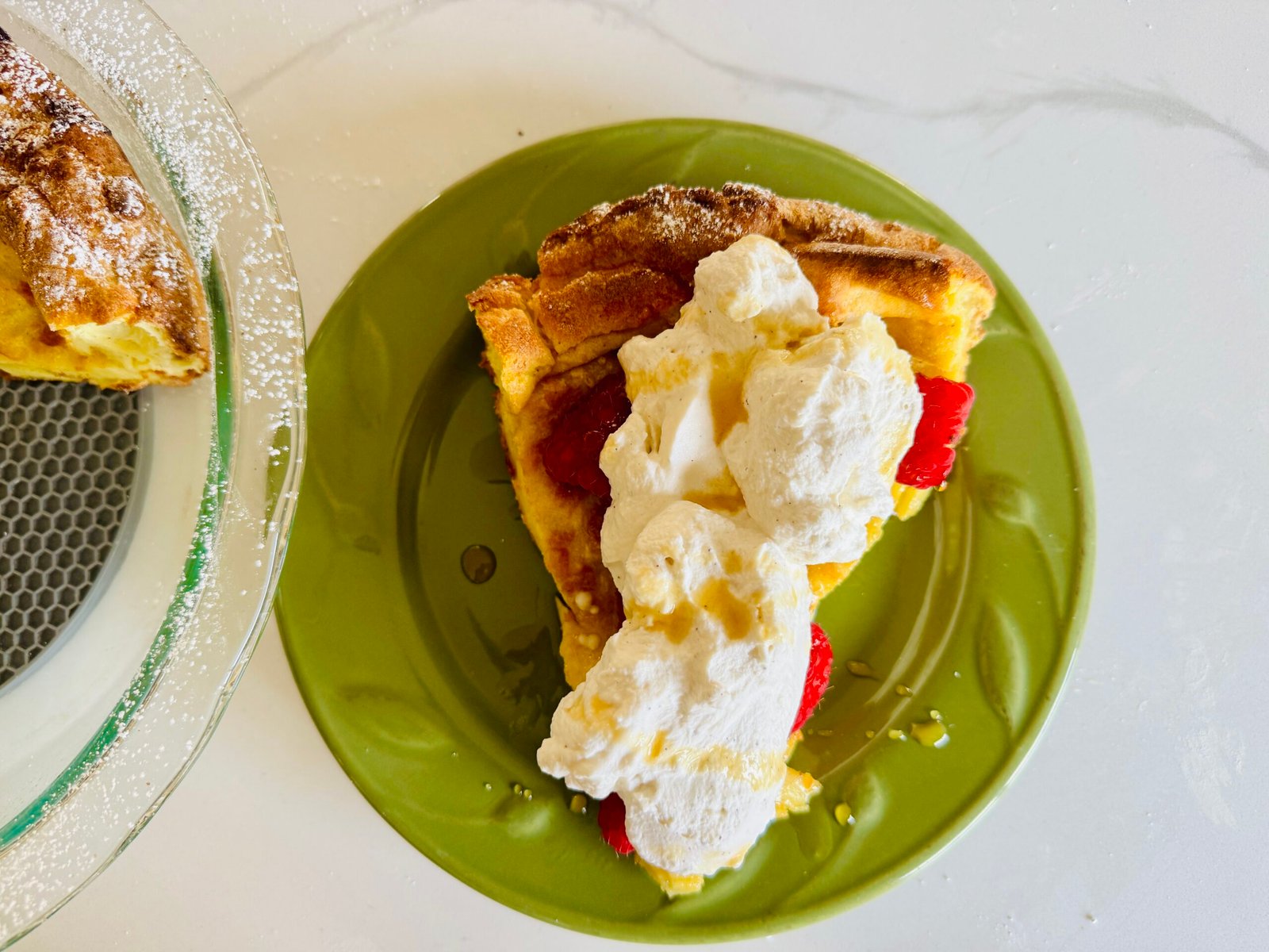 Easy German Pancake with raspberry and whipped cream