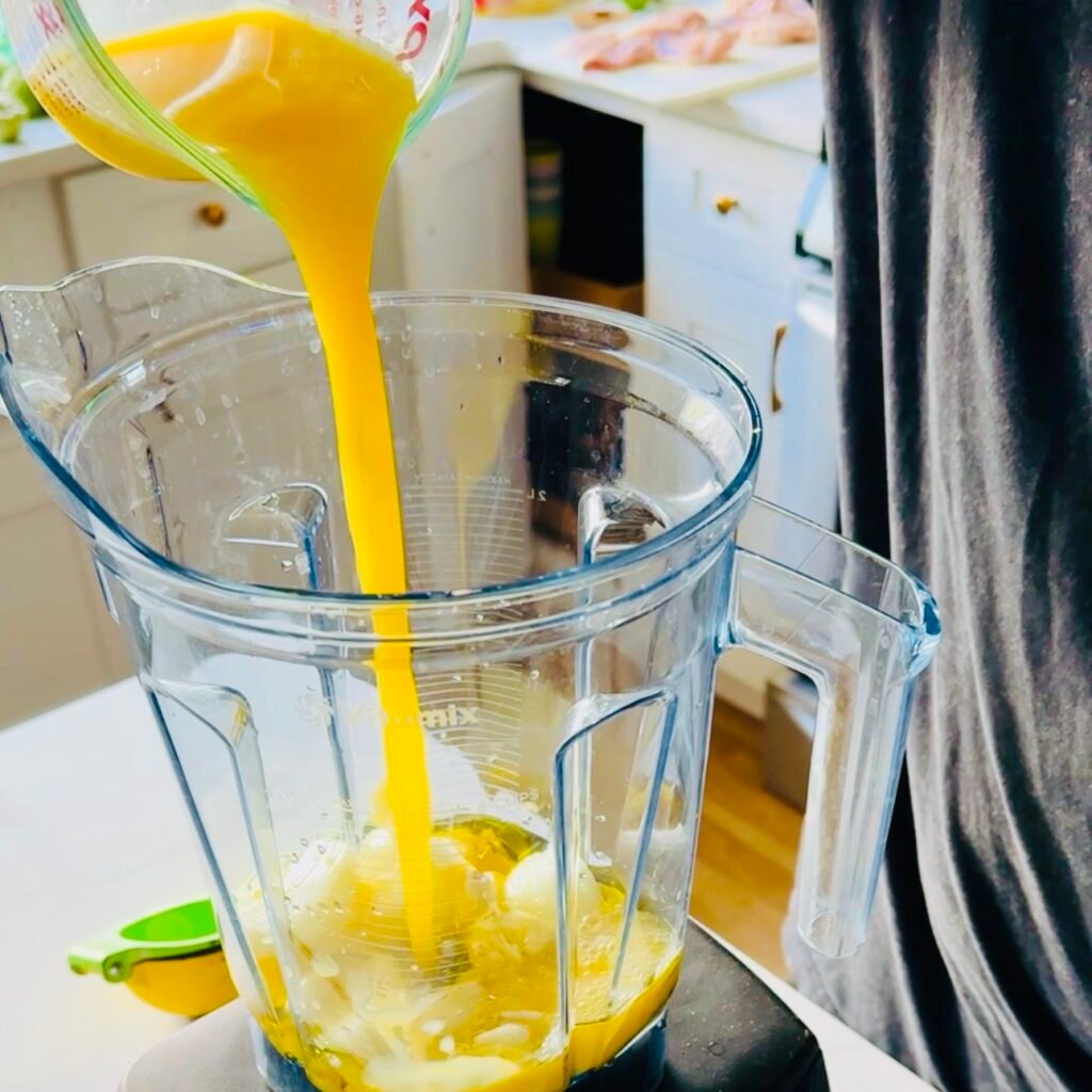 Making Mojo Marinade with Orange Juice and Lime