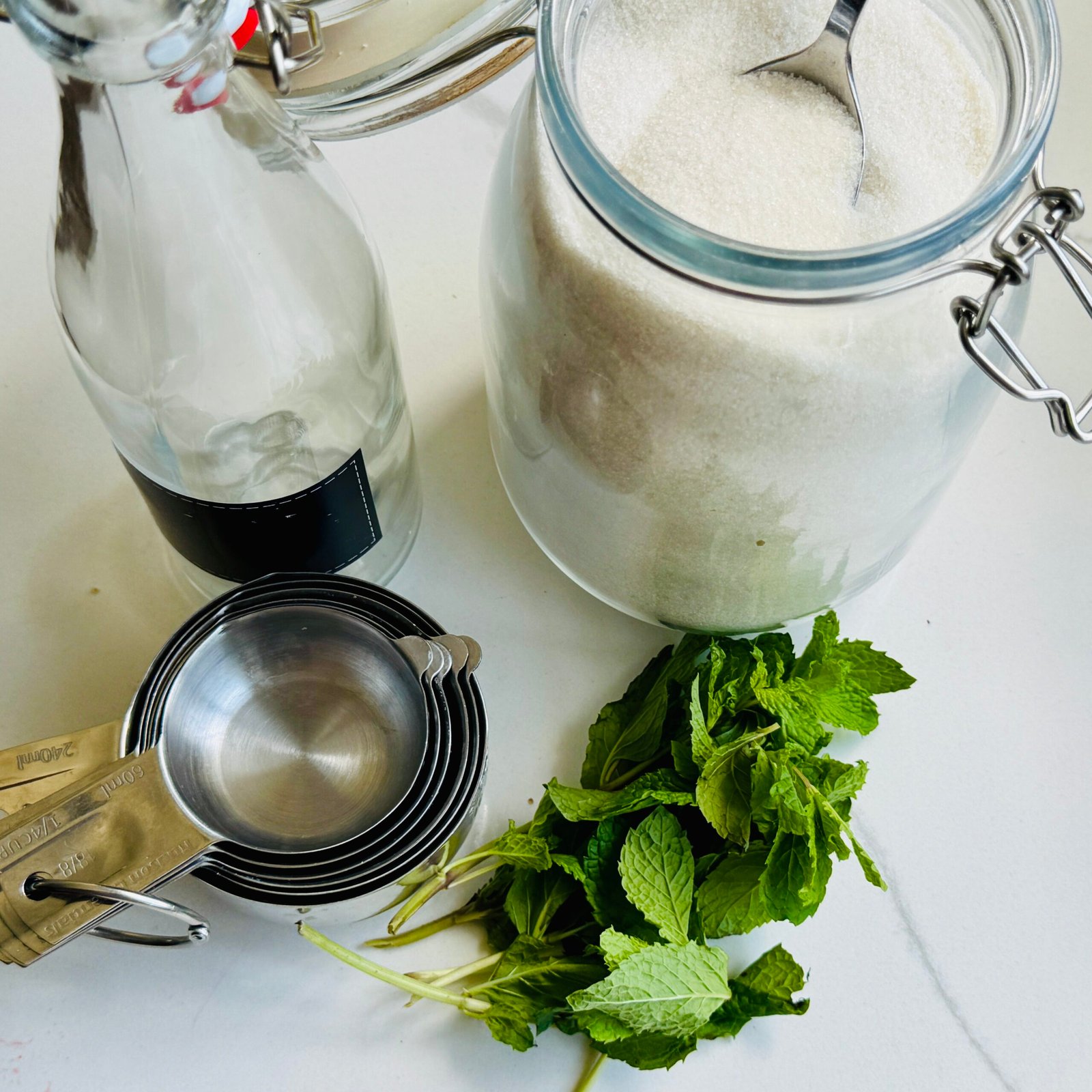 Sugar, water, fresh mint leaves for homemade mint simple syrup