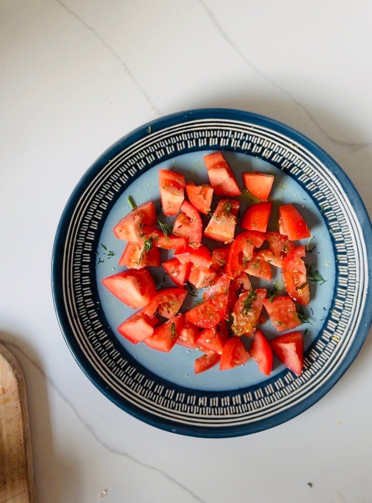Chopped tomatoes seasoned with salt, lemon, olive oil, and fresh dill.