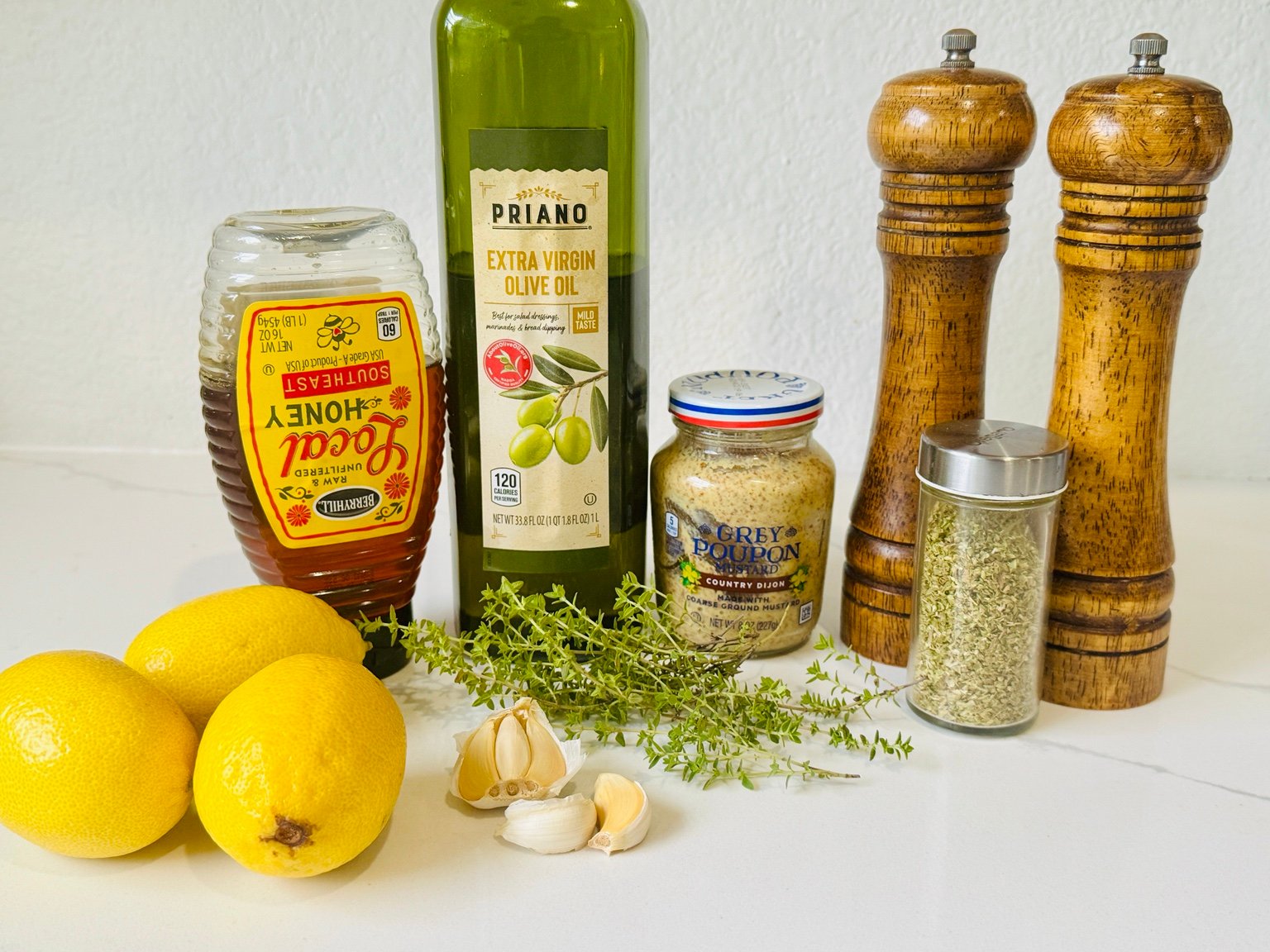Lemon Dijon Marinade Ingredients Lemons, Dijon mustard, olive oil, honey, garlic, thyme, oregano, salt, and pepper for the marinade.