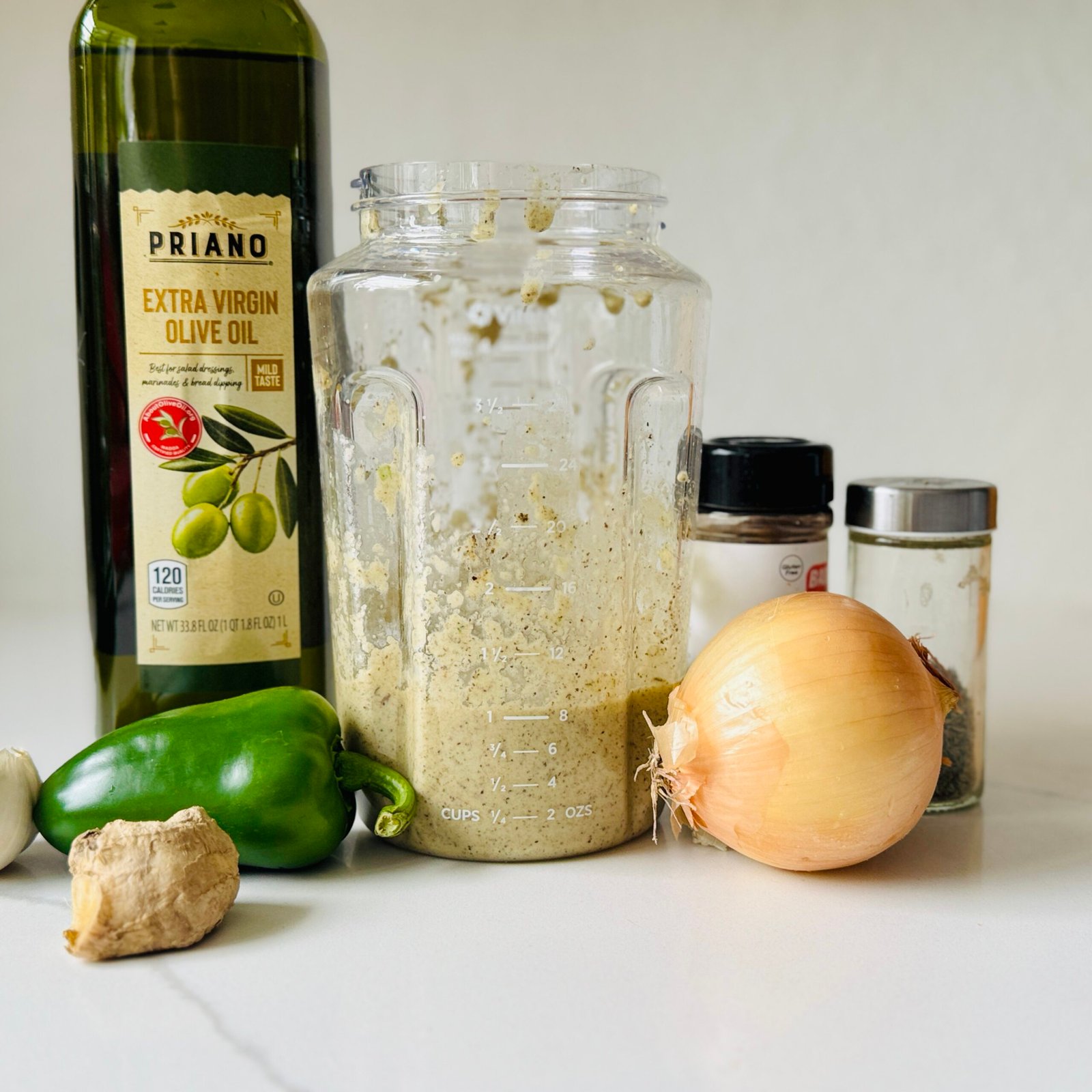 Homemade jerk marinade made from fresh onion, ginger, garlic, green chilies, allspice, thyme and lime.